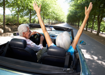retirement planning, older couple living a dream retirement, sports car
