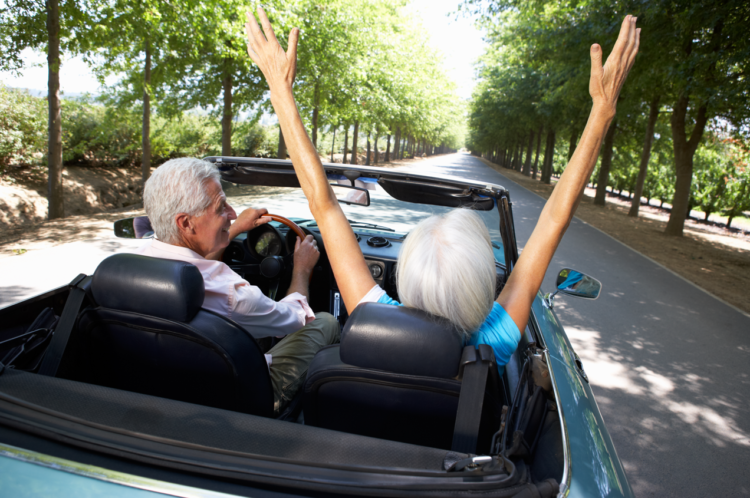 retirement planning, older couple living a dream retirement, sports car