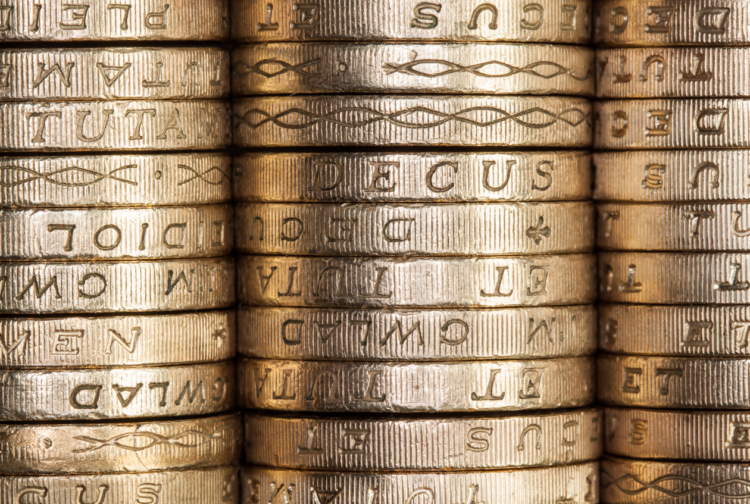 Stack of British pound coins, money, savings, pension